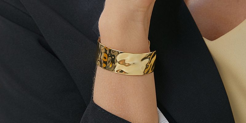 a model wearing a cuff bangle